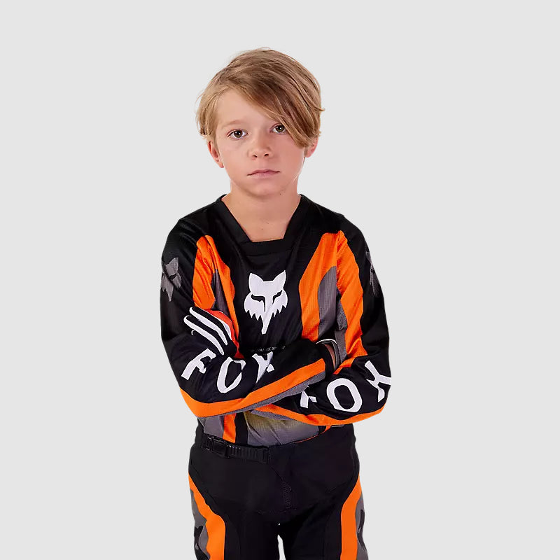 Polera Moto Niño 180 Ballast Negro/Naranjo Fox - Rideshop